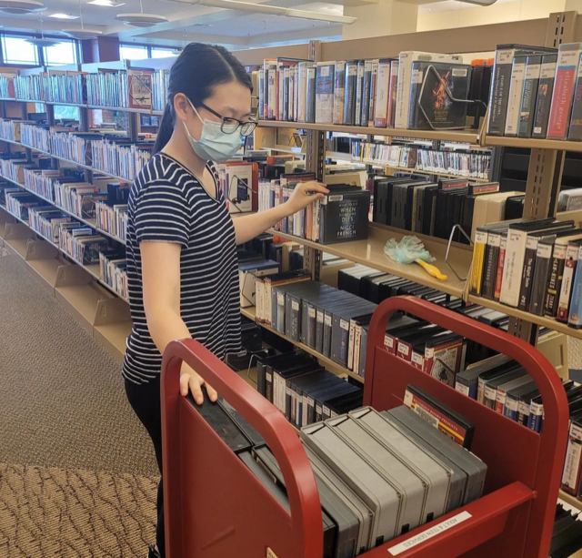 Woman shelving books