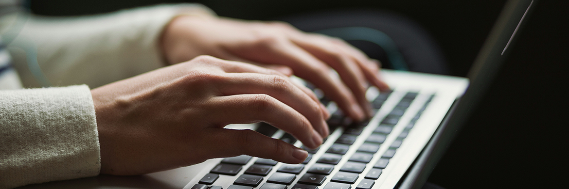 Person typing on laptop