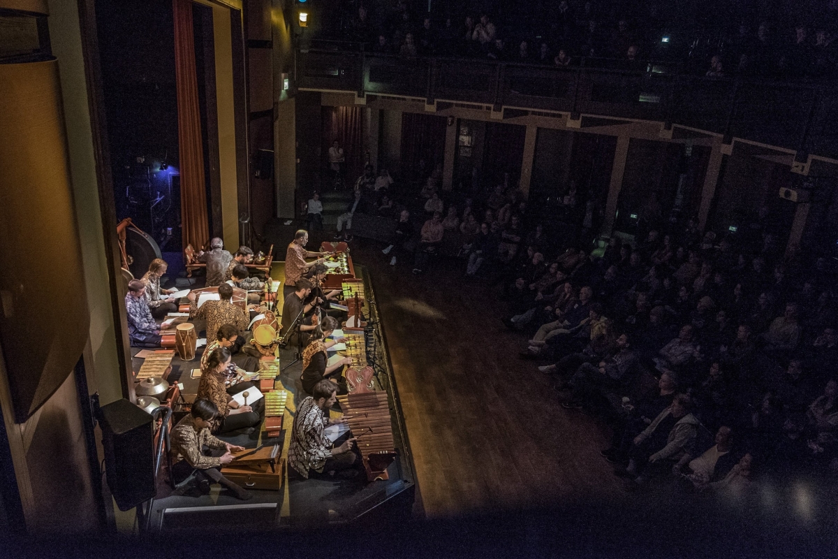 Top down view of Friends of Gamelan ensemble on stage.