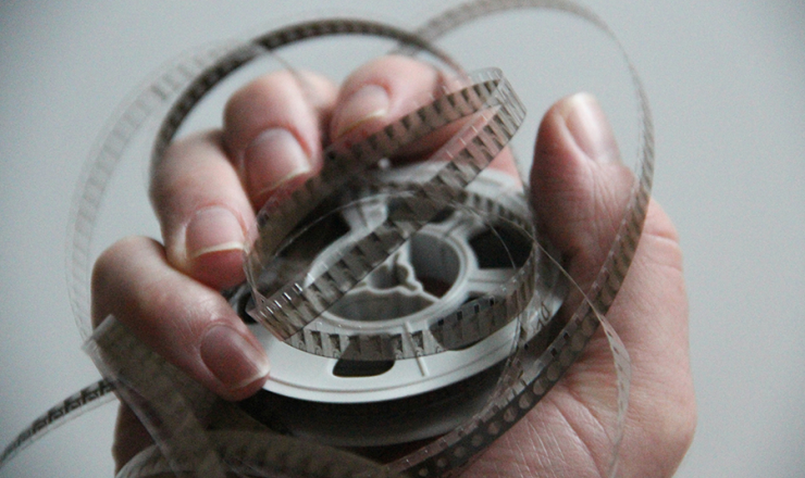 Hand holding a film roll