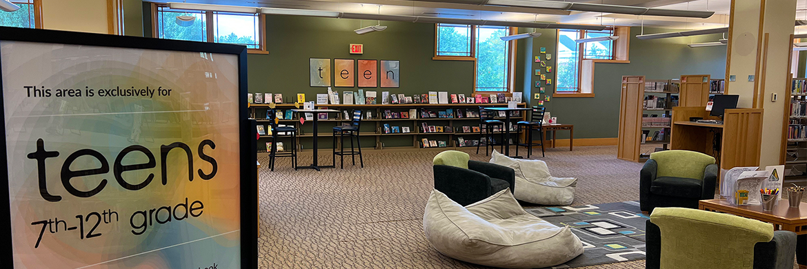 Teen Area showing sign, chairs, books